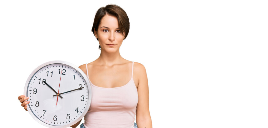 Woman holding clock