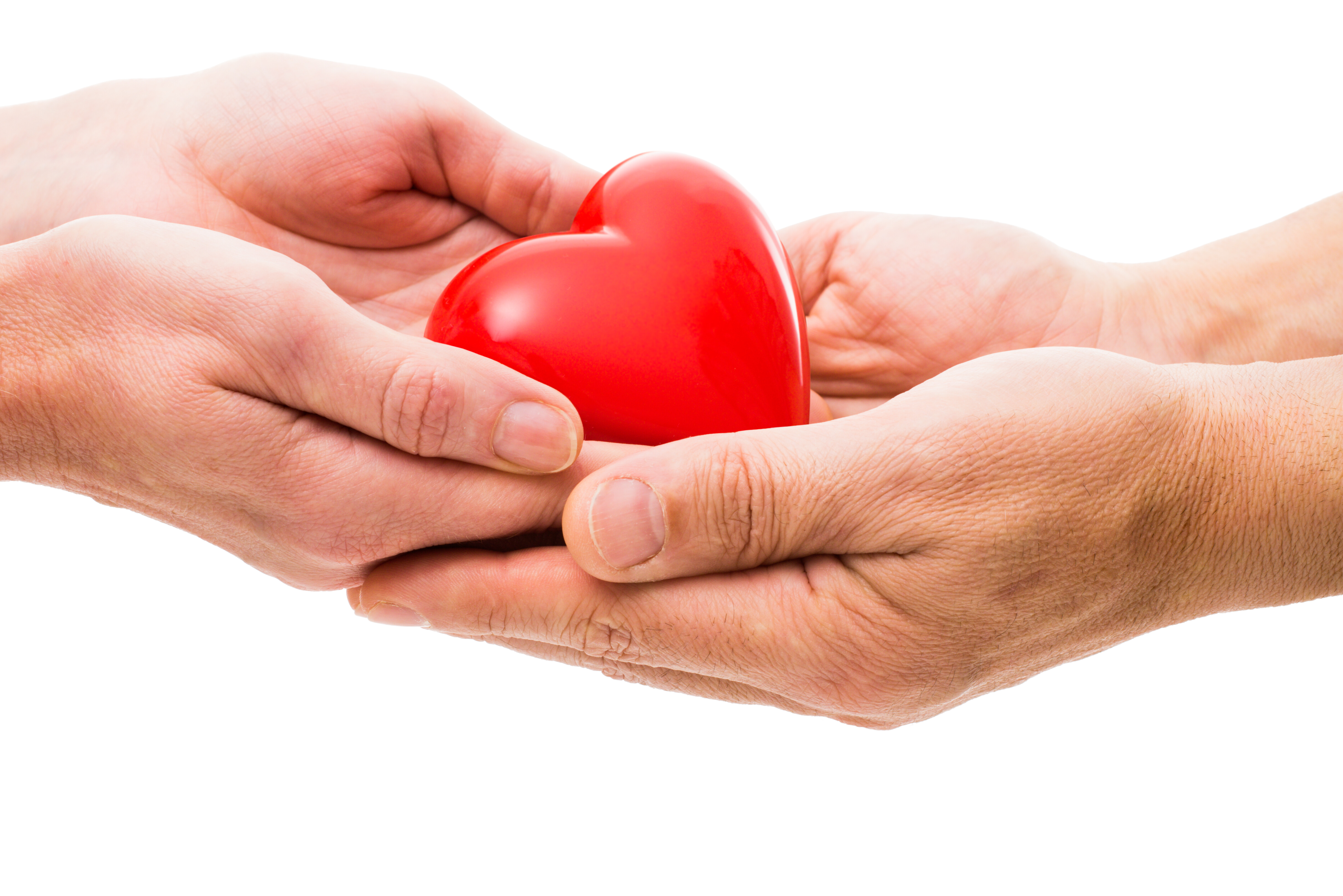 two hands holding red puffy heart